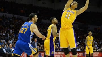 Oct 19, 2016; San Diego, CA, USA; Los Angeles Lakers forward Yi Jianlian (11) grabs a rebound against the Golden State Warriors during the second quarter at Valley View Casino Center. Mandatory Credit: Jake Roth-USA TODAY Sports