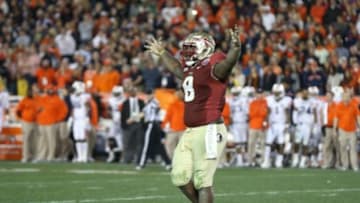 Jan 6, 2014; Pasadena, CA, USA; Florida State Seminoles nose tackle Timmy Jernigan (8) celebrates late in the fourth quarter against the Auburn Tigers for the 2014 BCS National Championship game at the Rose Bowl. Mandatory Credit: Matthew Emmons-USA TODAY Sports