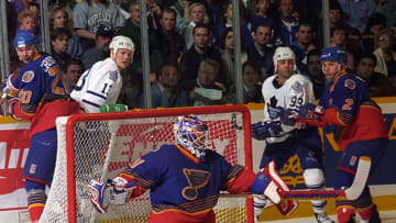 TORONTO, ON - APRIL 16: Grant Fuhr #31, Adam Creighton #20 and Al MacInnis #2 of the St. Louis Blues skate against Mats Sundin #13 and Doug Gilmour #93 of the Toronto Maple Leafs during the quarter finals of the1995-1996 NHL Playoffs at Maple Leaf Gardens in Toronto, Ontario, Canada. (Photo by Graig Abel/Getty Images)