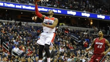 Mar 6, 2015; Washington, DC, USA; Washington Wizards guard John Wall (2) shoots the ball as Miami Heat forward Udonis Haslem (40) looks on during the first half at Verizon Center. Mandatory Credit: Brad Mills-USA TODAY Sports