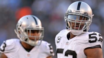 Dec 18, 2016; San Diego, CA, USA; Oakland Raiders defensive end Khalil Mack (52) and outside linebacker Malcolm Smith (53) look on during the fourth quarter against the San Diego Chargers at Qualcomm Stadium. Mandatory Credit: Jake Roth-USA TODAY Sports