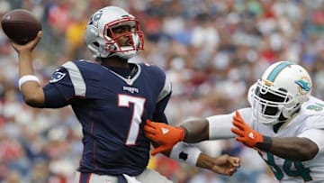 Sep 18, 2016; Foxborough, MA, USA; New England Patriots quarterback Jacoby Brissett (7) throws a pass against Miami Dolphins defensive end Mario Williams (94) in the second half at Gillette Stadium. The Patriots defeated the Miami Dolphins 31-24. Mandatory Credit: David Butler II-USA TODAY Sports
