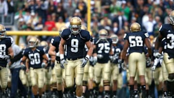 SOUTH BEND, IN - OCTOBER 03: Kyle Rudolph #9 of the Notre Dame Fighting Irish runs onto the field with teammates before a game against the Washington Huskies on October 3, 2009 at Notre Dame Stadium in South Bend, Indiana. Notre Dame defeated Washington 37-30 in overtime. (Photo by Jonathan Daniel/Getty Images)