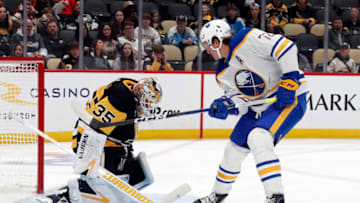 Sep 28, 2023; Pittsburgh, Pennsylvania, USA; Pittsburgh Penguins goaltender Tristan Jarry (35) makes a save against Buffalo Sabres right wing Tage Thompson (72) during the third period at PPG Paints Arena. Pittsburgh won 3-1. Mandatory Credit: Charles LeClaire-USA TODAY Sports