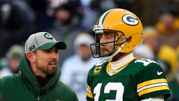 GREEN BAY, WISCONSIN - DECEMBER 15: head coach Matt LaFleur of the Green Bay Packers discusses with Aaron Rodgers #12 of the Green Bay Packers during warms up before the game against the Chicago Bears at Lambeau Field on December 15, 2019 in Green Bay, Wisconsin. (Photo by Quinn Harris/Getty Images)