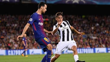 BARCELONA, SPAIN - SEPTEMBER 12: Sergio Busquets of Barcelona is put under pressure from Paulo Dybala of Juventus during the UEFA Champions League Group D match between FC Barcelona and Juventus at Camp Nou on September 12, 2017 in Barcelona, Spain. (Photo by Alex Caparros/Getty Images)