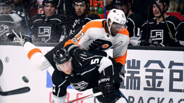 LOS ANGELES, CA - OCTOBER 05: Christian Folin #5 of the Los Angeles Kings checks Wayne Simmonds #17 of the Philadelphia Flyers during a 2-0 win over the Philadelphia Flyers on opening night of the Los Angeles Kings 2017-2018 season at Staples Center on October 5, 2017 in Los Angeles, California. (Photo by Harry How/Getty Images)