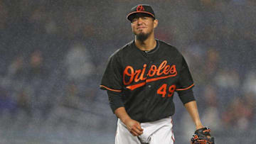Sep 30, 2016; Bronx, NY, USA; Baltimore Orioles starting pitcher Yovani Gallardo (49) reacts during the second inning against the New York Yankees at Yankee Stadium. Mandatory Credit: Adam Hunger-USA TODAY Sports