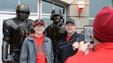 LINCOLN, NE - OCTOBER 14: Fans of the Nebraska Cornhuskers have their picture taken by the Tom Osborne statue before the game against the Ohio State Buckeyes at Memorial Stadium on October 14, 2017 in Lincoln, Nebraska. (Photo by Steven Branscombe/Getty Images)