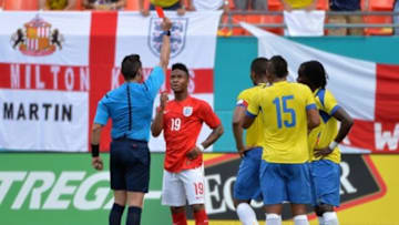 Jun 4, 2014; Miami Gardens, FL, USA; England midfielder Raheem Sterling (19) receives a red card during the second half as Ecuador forward Michael Antonio Arroyo Mina (15) looks on at Sun Life Stadium. Mandatory Credit: Steve Mitchell-USA TODAY Sports
