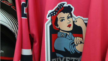The New York Riveters of the National Womens Hockey League jersey to fight cancer hangs in the lockerroom prior to the game against the Connecticut Whale on October 25, 2015 in Brooklyn borough of New York City. (Photo by Bruce Bennett/Getty Images)