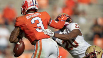 Clemson wide receiver Amari Rodgers fumbles the ball as he stiff-arms Boston College defensive back Elijah Jones (20) during the fourth quarter at Memorial Stadium.Ncaa Football Boston College At Clemson