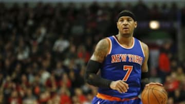Jan 1, 2016; Chicago, IL, USA; New York Knicks forward Carmelo Anthony (7) brings the ball up court against the Chicago Bulls during the second half at United Center. The Bulls won 108-81. Mandatory Credit: Kamil Krzaczynski-USA TODAY Sports