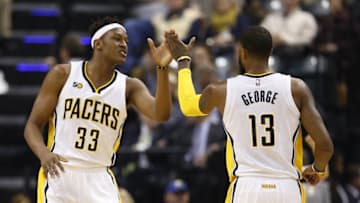 Jan 1, 2017; Indianapolis, IN, USA; Indiana Pacers forward Paul George (13) high fives center Myles Turner (33) after a play against the Orlando Magic at Bankers Life Fieldhouse. Mandatory Credit: Brian Spurlock-USA TODAY Sports