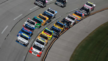 TALLADEGA, AL - OCTOBER 13: Johnny Sauter, driver of the #21 ISM Connect Chevrolet, and Myatt Snider, driver of the #13 RideTV Ford, lead a pack of trucks during the NASCAR Camping World Truck Series Fr8Auctions 250 at Talladega Superspeedway on October 13, 2018 in Talladega, Alabama. (Photo by Sean Gardner/Getty Images)