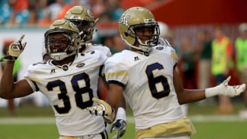 MIAMI GARDENS, FL - OCTOBER 14: Lamont Simmons #6 of the Georgia Tech Yellow Jackets celebrates with Ajani Kerr #38 after returning an onside kick for a touchdown during a game against the Miami Hurricanes at Sun Life Stadium on October 14, 2017 in Miami Gardens, Florida. (Photo by Mike Ehrmann/Getty Images)