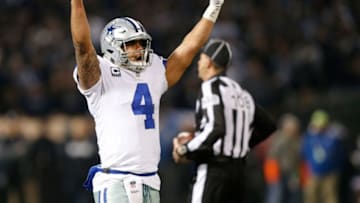OAKLAND, CA - DECEMBER 17: Dak Prescott #4 of the Dallas Cowboys celebrates in the final moments of their NFL game against the Oakland Raiders at Oakland-Alameda County Coliseum on December 17, 2017 in Oakland, California. (Photo by Lachlan Cunningham/Getty Images)