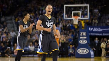 Mar 12, 2016; Oakland, CA, USA; Golden State Warriors guard Stephen Curry (30) celebrates after an asset to guard Shaun Livingston (34) for a basket against the Phoenix Suns during the fourth quarter at Oracle Arena. The Warriors defeated the Suns 123-116. Mandatory Credit: Kelley L Cox-USA TODAY Sports