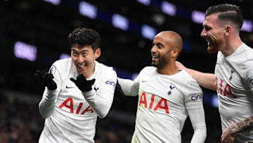 Tottenham Hotspur's South Korean striker Son Heung-Min (L), Tottenham Hotspur's Brazilian midfielder Lucas Moura (C) and Tottenham Hotspur's Danish midfielder Pierre-Emile Hojbjerg (R) celebrate after Son scores their third goal during the English Premier League football match between Tottenham Hotspur and Norwich City at Tottenham Hotspur Stadium in London, on December 5, 2021. - - RESTRICTED TO EDITORIAL USE. No use with unauthorized audio, video, data, fixture lists, club/league logos or 'live' services. Online in-match use limited to 120 images. An additional 40 images may be used in extra time. No video emulation. Social media in-match use limited to 120 images. An additional 40 images may be used in extra time. No use in betting publications, games or single club/league/player publications. (Photo by Daniel LEAL / AFP) / RESTRICTED TO EDITORIAL USE. No use with unauthorized audio, video, data, fixture lists, club/league logos or 'live' services. Online in-match use limited to 120 images. An additional 40 images may be used in extra time. No video emulation. Social media in-match use limited to 120 images. An additional 40 images may be used in extra time. No use in betting publications, games or single club/league/player publications. / RESTRICTED TO EDITORIAL USE. No use with unauthorized audio, video, data, fixture lists, club/league logos or 'live' services. Online in-match use limited to 120 images. An additional 40 images may be used in extra time. No video emulation. Social media in-match use limited to 120 images. An additional 40 images may be used in extra time. No use in betting publications, games or single club/league/player publications. (Photo by DANIEL LEAL/AFP via Getty Images)