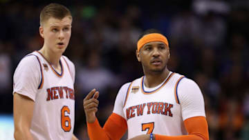 PHOENIX, AZ - DECEMBER 13: Kristaps Porzingis #6 and Carmelo Anthony #7 of the New York Knicks reacts during the second half of the NBA game against the Phoenix Suns at Talking Stick Resort Arena on December 13, 2016 in Phoenix, Arizona. The Suns defeated the Knicks 113-111 in overtime. (Photo by Christian Petersen/Getty Images)