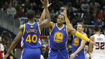 Jan 3, 2014; Atlanta, GA, USA; Golden State Warriors small forward Harrison Barnes (40) shows emotion with small forward Andre Iguodala (9) against the Atlanta Hawks in the fourth quarter at Philips Arena. The Warriors defeated the Hawks 101-100. Mandatory Credit: Brett Davis-USA TODAY Sports