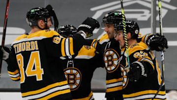 Apr 18, 2021; Boston, Massachusetts, USA; Boston Bruins center Patrice Bergeron (37) celebrates his shorthanded goal with center Brad Marchand (63) and defenseman Jarred Tinordi (84) during the first period against the Washington Capitals at TD Garden. Mandatory Credit: Winslow Townson-USA TODAY Sports