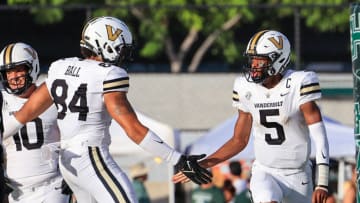 HONOLULU, HI - AUGUST 27: Mike Wright #5 of the Vanderbilt Commodores is congratulated by Justin Ball #84 of the Vanderbilt Commodores after scoring a touchdown during the first half of an NCAA football game against the Hawaii Rainbow Warriors at the Clarance T.C. Ching Athletic Complex on August 27, 2022 in Honolulu, Hawaii. (Photo by Darryl Oumi/Getty Images)