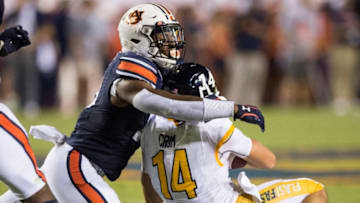 Auburn football linebacker Owen Pappoe (10) tackles Kent State quarterback Dustin Crum (14) at Jordan-Hare Stadium in Auburn, Ala., on Saturday, Sept. 14, 2019. Auburn defeated Kent State 55-16.Jc Auburnkent 87