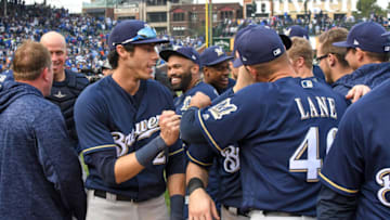 CHICAGO, IL - OCTOBER 1: Christian Yelich #22 of the Milwaukee Brewers celebrates with teammates after defeating the Chicago Cubs, 3-1, during the game against the Chicago Cubs on Monday, October 1, 2018 at Wrigley Field in Chicago, Illinois. (Photo by David Durochik/MLB Photos via Getty Images)