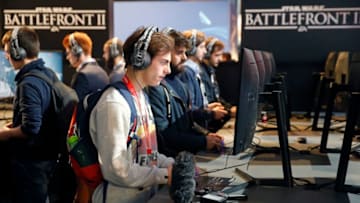 PARIS, FRANCE - OCTOBER 31: Gamers play the video game "Star Wars Battlefront II" developed by DICE, Criterion Games and Motive Studios and published by Electronics Arts on Sony PlayStation game consoles PS4 Pro during the 'Paris Games Week' on October 31, 2017 in Paris, France. 'Paris Games Week' is an international trade fair for video games to be held from October 31 to November 5, 2017. (Photo by Chesnot/Getty Images)