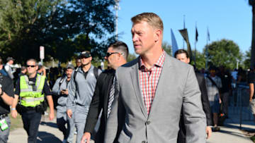 ORLANDO, FL - DECEMBER 2: Head coach Scott Frost of the UCF Knights walks up to the stadium with his team before pregame of the 2017 AAC Championship against the Memphis Tigers at Spectrum Stadium on December 2, 2017 in Orlando, Florida. (Photo by Julio Aguilar/Getty Images)