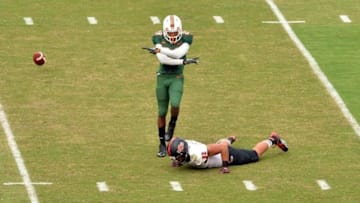 Sep 13, 2014; Miami Gardens, FL, USA; Arkansas State Red Wolves tight end Warren Leapheart (82) has his pass broken up by Miami Hurricanes defensive back Corn Elder (29) during the first half at Sun Life Stadium. Miami won 41-20. Mandatory Credit: Steve Mitchell-USA TODAY Sports
