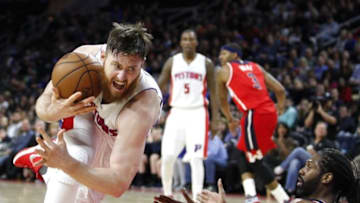 Apr 8, 2016; Auburn Hills, MI, USA; Detroit Pistons center Aron Baynes (12) knocks down Washington Wizards center Nene Hilario (42) during the fourth quarter at The Palace of Auburn Hills. Pistons win 112-99. Mandatory Credit: Raj Mehta-USA TODAY Sports
