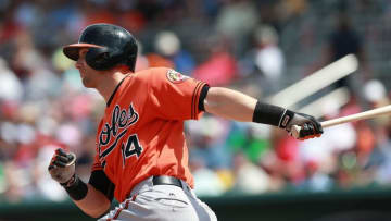Mar 28, 2016; Fort Myers, FL, USA; Baltimore Orioles left fielder Nolan Reimold (14) singles during the seventh inning against the Boston Red Sox at JetBlue Park. Mandatory Credit: Kim Klement-USA TODAY Sports