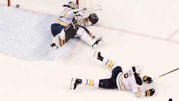SUNRISE, FL - NOVEMBER 30: Jack Eichel #9 of the Buffalo Sabres looks back at the net as the puck shot by Aleksander Barkov #16 of the Florida Panthers scores the winning goal in overtime past Goaltender Linus Ullmark #35at the BB&T Center on November 30, 2018 in Sunrise, Florida. The Panthers defeated the Sabres 3-2 in overtime. (Photo by Joel Auerbach/Getty Images)