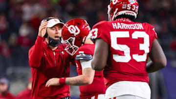 Dec 30, 2020; Arlington, TX, USA; Oklahoma Sooners quarterback Spencer Rattler (7) celebrates with head coach Lincoln Riley after scoring a touchdown during the first half against the Florida Gators at AT&T Stadium. Mandatory Credit: Kevin Jairaj-USA TODAY Sports