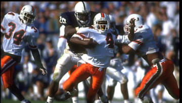 10 OCT 1992: UNIVERSITY OF MIAMI HURRICANES RUNNING BACK PAUL WHITE #4 CARRIES THE FOOTBALL DURING THE CANES 17-14 WIN OVER THE PENN STATE NITTANY LIONS AT BEAVER STADIUM IN UNIVERSITY PARK, PENNSYLVANIA.