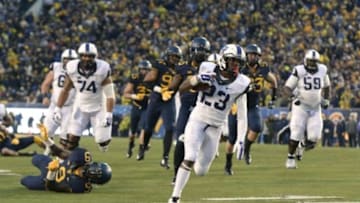 Nov 1, 2014; Morgantown, WV, USA; TCU Horned Frogs running back B.J. Catalon (23) runs for a touchdown during the third quarter against the TCU Horned Frogs at Milan Puskar Stadium. TCU defeated West Virginia, 31-30. Mandatory Credit: Tommy Gilligan-USA TODAY Sports