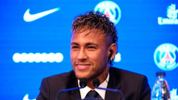 Brazilian superstar Neymar listens during a press conference at the Parc des Princes stadium on August 4, 2017 in Paris after agreeing a five-year contract following his world record 222 million euro ($260 million) transfer from Barcelona to Paris Saint-Germain.Paris Saint-Germain have signed Brazilian forward Neymar from Barcelona for a world-record transfer fee of 222 million euros (around $264 million), more than doubling the previous record. Neymar said he came to Paris Saint-Germain for a "bigger challenge" in his first public comments since arriving in the French capital. / AFP PHOTO / Lionel BONAVENTURE (Photo credit should read LIONEL BONAVENTURE/AFP via Getty Images)