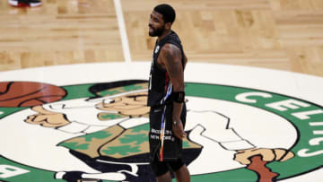 BOSTON, MASSACHUSETTS - DECEMBER 25: Kyrie Irving #11 of the Brooklyn Nets looks on during the third quarter of the game against the Boston Celtics at TD Garden on December 25, 2020 in Boston, Massachusetts. NOTE TO USER: User expressly acknowledges and agrees that, by downloading and or using this photograph, User is consenting to the terms and conditions of the Getty Images License Agreement. (Photo by Omar Rawlings/Getty Images)