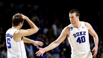 Mar 19, 2016; Providence, RI, USA; Duke Blue Devils guard Luke Kennard (5) and center Marshall Plumlee (40) celebrate after their victory over the Yale Bulldogs in a second round game of the 2016 NCAA Tournament at Dunkin Donuts Center. Duke won 71-64. Mandatory Credit: Mark L. Baer-USA TODAY Sports