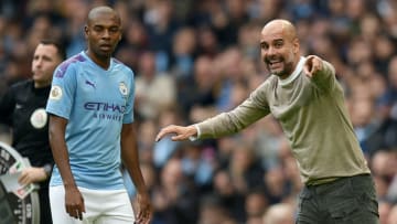 Manchester City's Spanish manager Pep Guardiola (R) gives instructions to Manchester City's Brazilian midfielder Fernandinho during the English Premier League football match between Manchester City and Wolverhampton Wanderers at the Etihad Stadium in Manchester, north west England, on October 6, 2019. (Photo by Oli SCARFF / AFP) / RESTRICTED TO EDITORIAL USE. No use with unauthorized audio, video, data, fixture lists, club/league logos or 'live' services. Online in-match use limited to 120 images. An additional 40 images may be used in extra time. No video emulation. Social media in-match use limited to 120 images. An additional 40 images may be used in extra time. No use in betting publications, games or single club/league/player publications. / (Photo by OLI SCARFF/AFP via Getty Images)