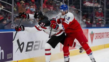 EDMONTON, AB - DECEMBER 26: Kaiden Guhle of Canada battles Jan Mysak. (Photo by Codie McLachlan/Getty Images)