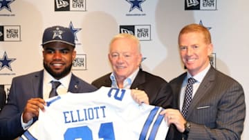 Apr 29, 2016; Irving, TX, USA; Dallas Cowboys number one draft pick Ezekiel Elliott answers questions with owner Jerry Jones (center) and head ooach Jason Garrett (right) at Dallas Cowboys Headquarters Mandatory Credit: Matthew Emmons-USA TODAY Sports
