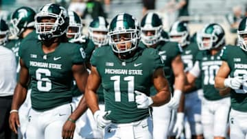 Michigan State running back Connor Heyward (11) warms up before the Youngstown State game at Spartan Stadium in East Lansing on Saturday, Sept. 11, 2021.