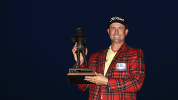 HILTON HEAD ISLAND, SOUTH CAROLINA - JUNE 21: Webb Simpson of the United States celebrates with the trophy and the plaid jacket after winning during the final round of the RBC Heritage on June 21, 2020 at Harbour Town Golf Links in Hilton Head Island, South Carolina. (Photo by Streeter Lecka/Getty Images)
