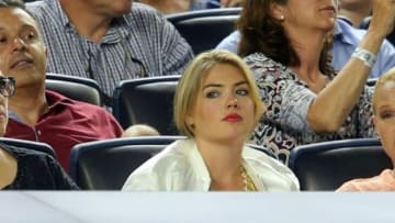Aug 4, 2014; Bronx, NY, USA; American supermodel Kate Upton looks on from behind the Tigers dugout during the fourth inning of a game between the New York Yankees and the Detroit Tigers at Yankee Stadium. Mandatory Credit: Brad Penner-USA TODAY Sports