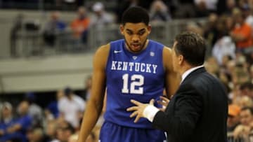 Feb 7, 2015; Gainesville, FL, USA; Kentucky Wildcats forward Karl-Anthony Towns (12) talks with head coach John Calipari against the Florida Gators during the second half at Stephen C. O