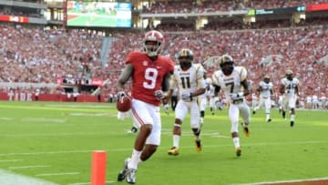 Sep 13, 2014; Tuscaloosa, AL, USA; Alabama Crimson Tide wide receiver Amari Cooper (9) jogs into the end zone for a touchdown against the Southern Miss Golden Eagles during the first quarter at Bryant-Denny Stadium. Mandatory Credit: John David Mercer-USA TODAY Sports