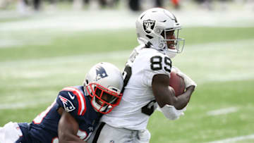 Sep 27, 2020; Foxborough, Massachusetts, USA; New England Patriots cornerback Jason McCourty (30) tackles Las Vegas Raiders wide receiver Bryan Edwards (89) during the third quarter at Gillette Stadium. Mandatory Credit: Brian Fluharty-USA TODAY Sports